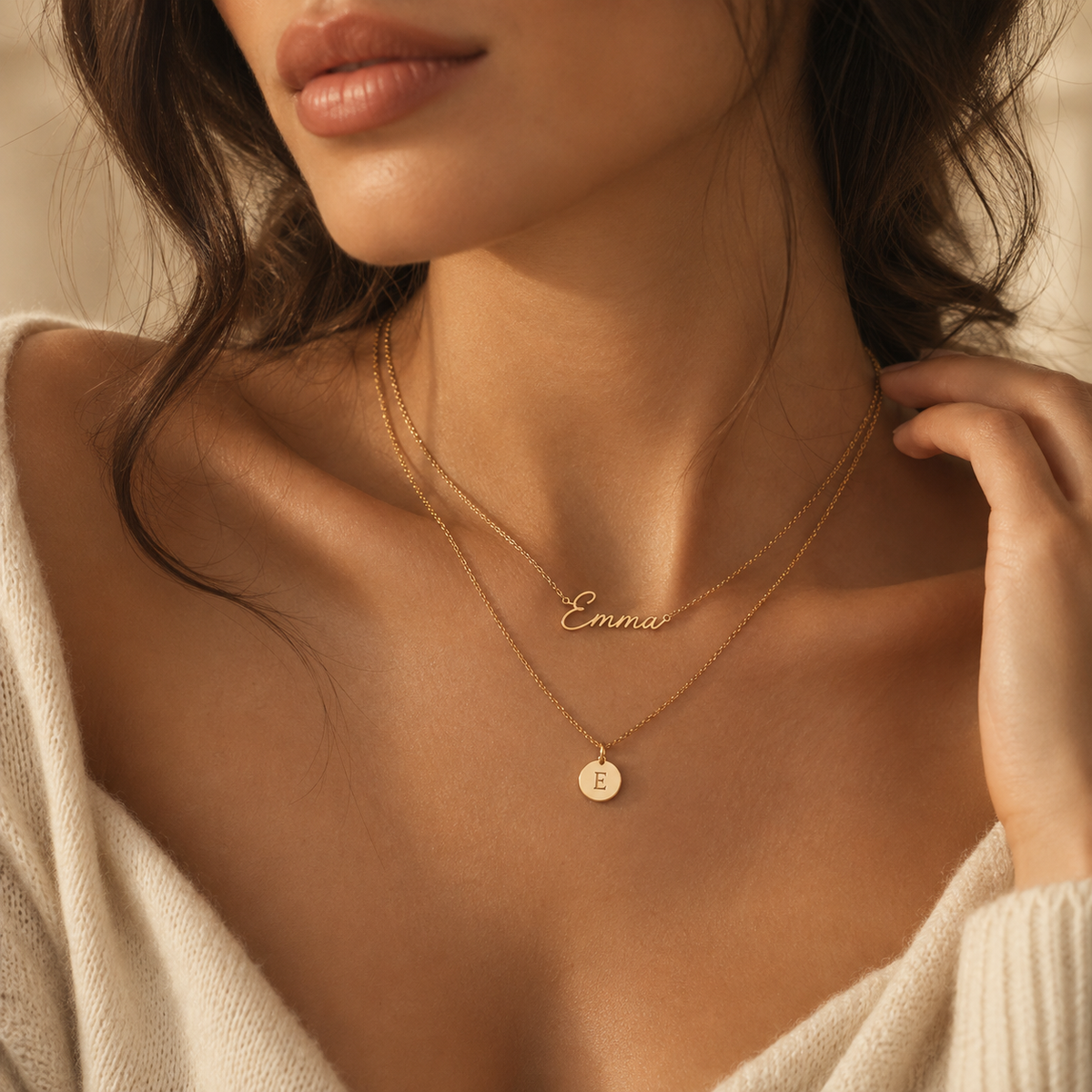 Close-up model wearing personalized name and initial necklaces
