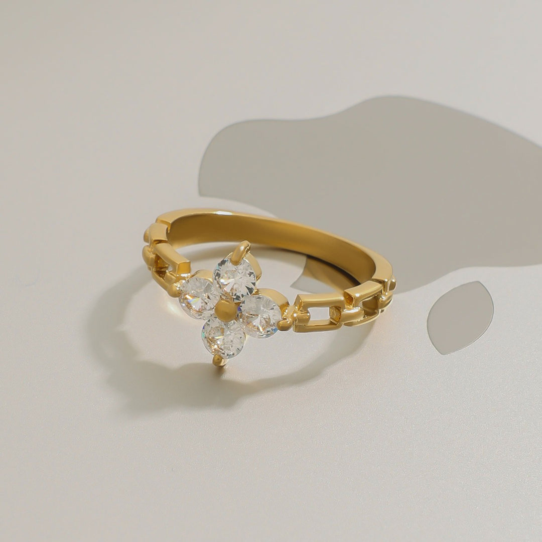 Side view of Flower-shaped gemstone-set ring